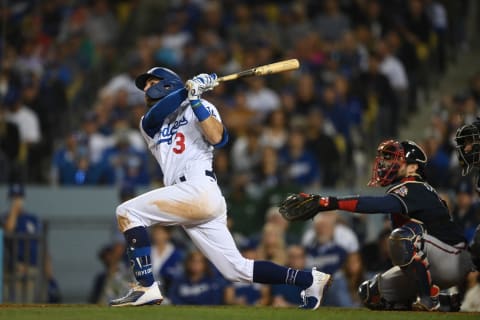 Oct 21, 2021; Los Angeles, California, USA; Los Angeles Dodgers left fielder Chris Taylor (3) hits a home run in the seventh inning against the Atlanta Braves during game five of the 2021 NLCS at Dodger Stadium. Mandatory Credit: Jayne Kamin-Oncea-USA TODAY Sports