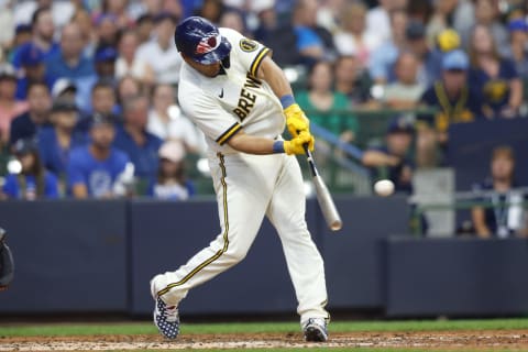 Jul 4, 2022; Milwaukee, Wisconsin, USA; Milwaukee Brewers catcher Pedro Severino (28) hits an RBI double during the seventh inning against the Chicago Cubs at American Family Field. Mandatory Credit: Jeff Hanisch-USA TODAY Sports