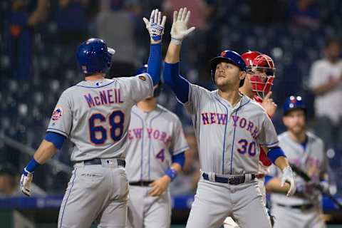 PHILADELPHIA, PA – SEPTEMBER 17: Jeff McNeil #68 of the New York Mets high fives Michael Conforto #30 after Conforto hit a three run home run in the top of the ninth inning against the Philadelphia Phillies at Citizens Bank Park on September 17, 2018 in Philadelphia, Pennsylvania. The Mets defeated the Phillies 9-4. (Photo by Mitchell Leff/Getty Images)