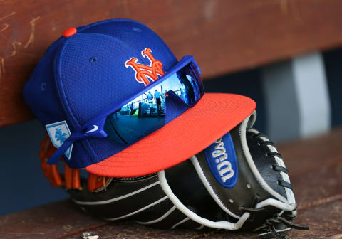 WEST PALM BEACH, FL – MARCH 11: The New Era cap, Nike sunglasses and Wilson glove of Michael Conforto #30 of the New York Mets during a spring training baseball game against the Houston Astros at Fitteam Ballpark of the Palm Beaches on March 11, 2019 in West Palm Beach, Florida. The Astros defeated the Mets 6-3. (Photo by Rich Schultz/Getty Images)