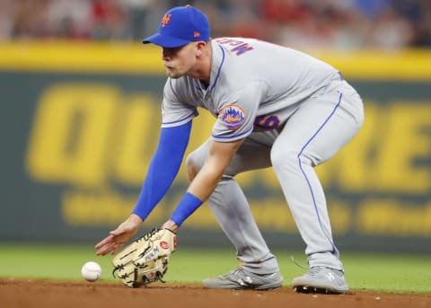 ATLANTA, GA – APRIL 12: Jeff McNeil #6 of the New York Mets fields a ground ball in the seventh inning of an MLB game against the Atlanta Braves at SunTrust Park on April 12, 2019 in Atlanta, Georgia. (Photo by Todd Kirkland/Getty Images)