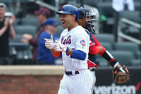 NEW YORK, NEW YORK – APRIL 07: Michael Conforto #30 of the New York Mets celebrates after hitting a three run home run in the ninth inning against the Washington Nationals at Citi Field on April 07, 2019 in New York City. (Photo by Mike Stobe/Getty Images)