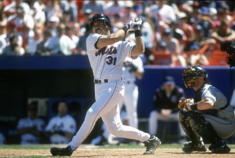 NEW YORK – CIRCA 2000: Mike Piazza #31 of the New York Mets bats during a Major League Baseball game circa 2000 at Shea Stadium in the Queens borough of New York City. Piazza played for the Mets from 1998-2005. (Photo by Focus on Sport/Getty Images)