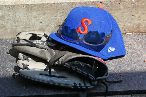 ALLENTOWN, PA – MAY 02: The Rawlings glove, New Era cap and Keanon sunglasses of Tim Tebow #15 of the Syracuse Mets sit on the dugout step during a AAA minor league baseball game against the Lehigh Valley Iron Pigs on May 1, 2019 at Coca Cola Park in Allentown, Pennsylvania. (Photo by Rich Schultz/Getty Images)