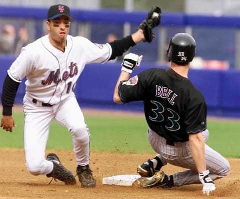 New York Mets shortstop Rey Ordonez (L) tags out Arizona Diamondbacks runner Jay Bell (33) as he tried to steal second base in the first inning of game 4 of the National League Division Series at Shea Stadium in Flushing, NY. The Mets have a 2-1 lead in the best-of-five series. (ELECTRONIC IMAGE) AFP PHOTO/Timothy A. CLARY (Photo by Timothy A. CLARY / AFP) (Photo credit should read TIMOTHY A. CLARY/AFP via Getty Images)