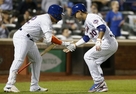 NEW YORK, NEW YORK – JUNE 07: Michael Conforto #30 of the New York Mets celebrates his sixth inning home run against the Colorado Rockies with teammate Dominic Smith #22 at Citi Field on June 07, 2019 in New York City. (Photo by Jim McIsaac/Getty Images)