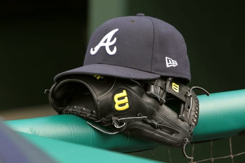 PHILADELPHIA, PA – JULY 26: A New Era cap and Wilson glove of an Atlanta Braves’s player before a game against the Philadelphia Phillies at Citizens Bank Park on July 26, 2019 in Philadelphia, Pennsylvania. (Photo by Rich Schultz/Getty Images)