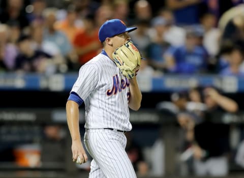 NEW YORK, NEW YORK – AUGUST 21: Brad Brach #29 of the New York Mets reacts after a run is scored by the Cleveland Indians in the sixth inning at Citi Field on August 21, 2019 in the Flushing neighborhood of the Queens borough of New York City. (Photo by Elsa/Getty Images)