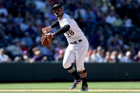 DENVER, COLORADO – SEPTEMBER 12: Nolan Arenado #28 of the Colorado Rockies fields a ball hit by Jose Martinez of the St Louis Cardinals inning in the sixth inning at Coors Field on September 12, 2019 in Denver, Colorado. (Photo by Matthew Stockman/Getty Images)