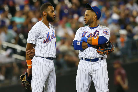 NEW YORK, NY – SEPTEMBER 15: Amed Rosario #1 and Robinson Cano #24 of the New York Mets in action against the Los Angeles Dodgers during of a game at Citi Field on September 15, 2019 in New York City. (Photo by Rich Schultz/Getty Images)