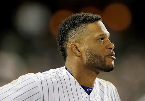 NEW YORK, NEW YORK – SEPTEMBER 24: Robinson Cano #24 of the New York Mets looks on from the dugout in the second inning against the Miami Marlins at Citi Field on September 24, 2019 in the Flushing neighborhood of the Queens borough of New York City. (Photo by Elsa/Getty Images)