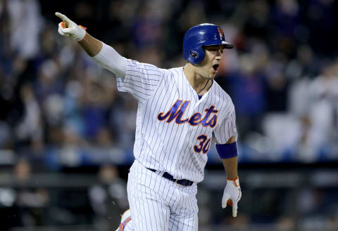 NEW YORK, NEW YORK – SEPTEMBER 24: Michael Conforto #30 of the New York Mets celebrates his two run home run in the bottom of the ninth inning to tie the game against the Miami Marlins at Citi Field on September 24, 2019 in the Flushing neighborhood of the Queens borough of New York City. (Photo by Elsa/Getty Images)