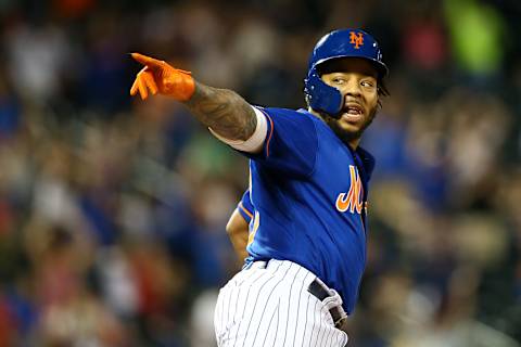 NEW YORK, NEW YORK – SEPTEMBER 29: Dominic Smith #22 of the New York Mets celebrates after hitting a walk-off 3-run home run in the bottom of the eleventh inning against the Atlanta Braves at Citi Field on September 29, 2019 in New York City. (Photo by Mike Stobe/Getty Images)