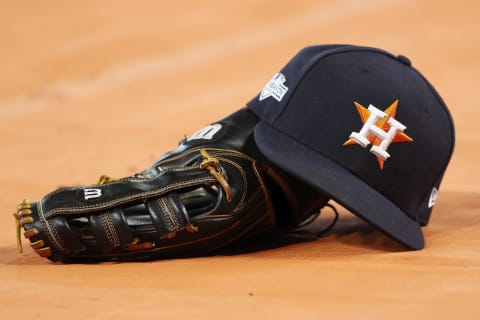 HOUSTON, TX – OCTOBER 19: A Houston Astros hat and glove are seen on the field before Game Six of the League Championship Series against the New York Yankees at Minute Maid Park on October 19, 2019 in Houston, Texas. (Photo by Tim Warner/Getty Images)