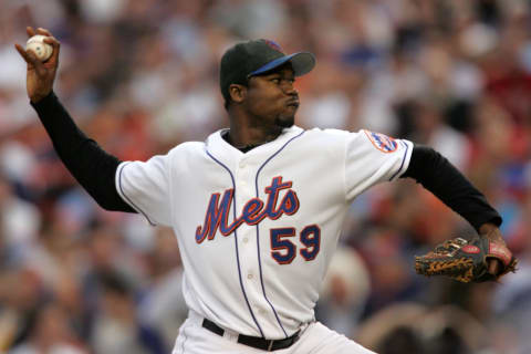 Guillermo Mota #59 of the New York Mets pitches against the Los Angeles Dodgers during game one of the 2006 National League Divisional Series at Shea Stadiujm, on Oct 4, 2006 in New York. The Mets defeated the Dodgers 6-5. (Photo by Chris Trotman/Getty Images)