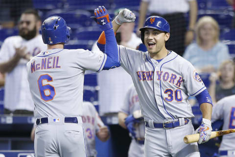 MIAMI, FLORIDA – JULY 14: Jeff McNeil #6 of the New York Mets celebrates with Michael Conforto #30 after hitting a solo home run in the first inning against the Miami Marlins at Marlins Park on July 14, 2019 in Miami, Florida. (Photo by Michael Reaves/Getty Images)