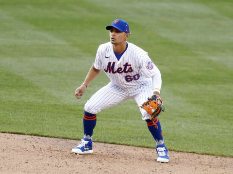 NEW YORK, NEW YORK – JULY 25: Andres Gimenez #60 of the New York Mets defends at second base against the Atlanta Braves at Citi Field on July 25, 2020 in New York City. The 2020 season had been postponed since March due to the COVID-19 pandemic. The Braves defeated the Mets 5-3 in ten innings. (Photo by Jim McIsaac/Getty Images)