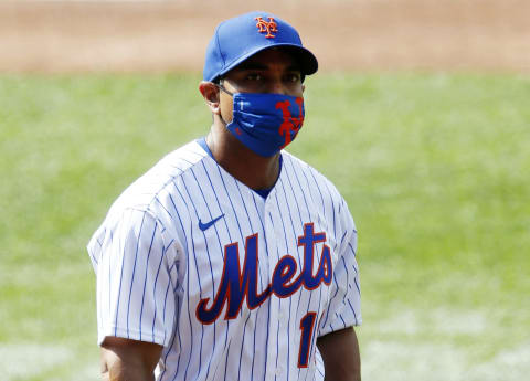 NEW YORK, NEW YORK – JULY 25: Manager Luis Rojas #19 of the New York Mets walks on the field before a game against the Atlanta Braves at Citi Field on July 25, 2020 in New York City. The 2020 season had been postponed since March due to the COVID-19 pandemic. The Braves defeated the Mets 5-3 in ten innings. (Photo by Jim McIsaac/Getty Images)