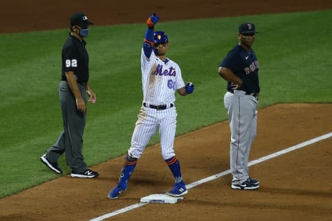 NEW YORK, NEW YORK – JULY 29: Andres Gimenez #60 of the New York Mets celebrates after hittinga RBI triple in the sixth inning against the Boston Red Sox at Citi Field on July 29, 2020 in New York City. (Photo by Mike Stobe/Getty Images)