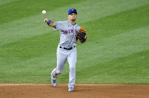 WASHINGTON, DC – AUGUST 04: Andres Gimenez #60 of the New York Mets throws the ball to first base against the Washington Nationals at Nationals Park on August 4, 2020 in Washington, DC. (Photo by G Fiume/Getty Images)