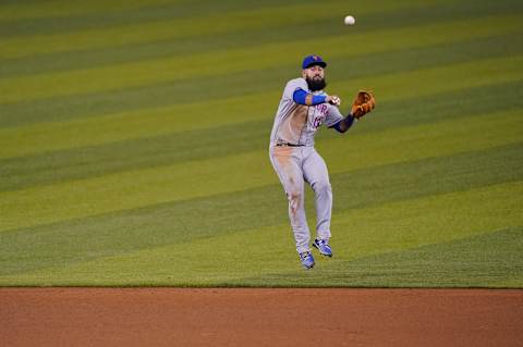 MIAMI, FLORIDA – AUGUST 19: Luis Guillorme #13 of the New York Mets makes the throw to first base during the game against the Miami Marlins at Marlins Park on August 19, 2020 in Miami, Florida. (Photo by Mark Brown/Getty Images)