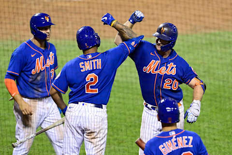 NEW YORK, NEW YORK – AUGUST 12: Pete Alonso #20 of the New York Mets is congratulated by his teammates Dominic Smith #2, Michael Conforto #30 and Andres Gimenez #60 after hitting a two run home run against the Washington Nationals during the sixth inning at Citi Field on August 12, 2020 in New York City. (Photo by Steven Ryan/Getty Images)