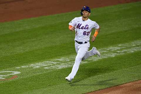 NEW YORK, NEW YORK – SEPTEMBER 19: Andres Gimenez #60 of the New York Mets runs to home during the fourth inning against the Atlanta Braves at Citi Field on September 19, 2020 in the Queens borough of New York City. (Photo by Sarah Stier/Getty Images)