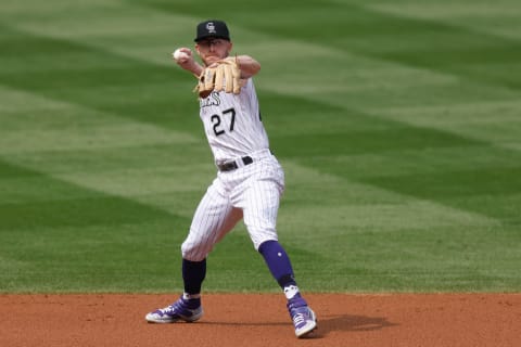 DENVER, CO – SEPTEMBER 16: Trevor Story #27 of the Colorado Rockies throws to first base for an out during the second inning against the Oakland Athletics at Coors Field on September 16, 2020 in Denver, Colorado. (Photo by Justin Edmonds/Getty Images)