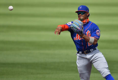 JUPITER, FLORIDA – MARCH 01: Francisco Lindor #12 of the New York Mets makes the throw to first base for the out in the fourth inning against the Miami Marlins in a spring training game at Roger Dean Chevrolet Stadium on March 01, 2021 in Jupiter, Florida. (Photo by Mark Brown/Getty Images)