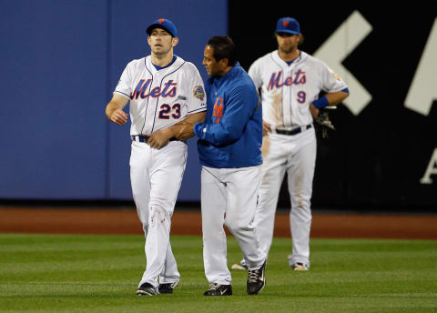 NEW YORK, NY – JUNE 01: Head Trainer Ray Ramirez walks Mike Baxter #23 of the New York Mets back to the dugout after being injured crashing into the wall during the game against the St. Louis Cardinals at Citi Field on June 1, 2012 in the Flushing neighborhood of the Queens borough of New York City. (Photo by Mike Stobe/Getty Images)