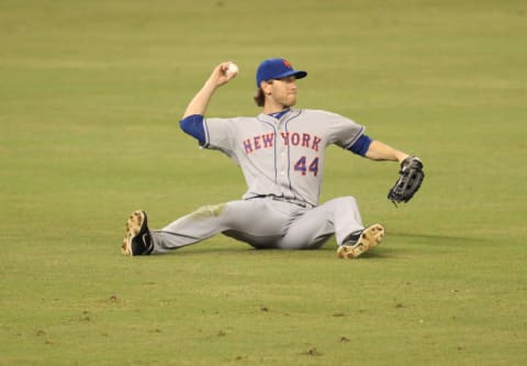 MIAMI, FL – SEPTEMBER 02: Outfielder Jason Bay #44 of the New York Mets throws the ball after missing a catch against the Miami Marlins at Marlins Park on September 2, 2012 in Miami, Florida. (Photo by Marc Serota/Getty Images)