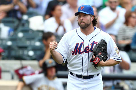 NEW YORK, NY – SEPTEMBER 27: (NEW YORK DAILIES OUT) R.A. Dickey #43 of the New York Mets celebrates the final out of the seventh inning against the Pittsburgh Pirates at Citi Field on September 27, 2012 in the Flushing neighborhood of the Queens borough of New York City. The Mets defeated the Pirates 6-5.. (Photo by Jim McIsaac/Getty Images)