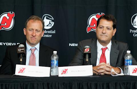 NEWARK, NJ – AUGUST 15: New Jersey Devils owners Joshua Harris (L) and David Blitzer look on during the press conference announcing their purchase of the New Jersey Devils on August 15, 2013 in Newark, New Jersey. (Photo by Andy Marlin/Getty Images)