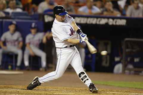 FLUSHING, NY – JULY 01: First baseman Jason Phillips #23 of the New York Mets swings at the pitch during the National League game against the Montreal Expos at Shea Stadium on July 1, 2003 in Flushing, New York. The Mets defeated the Expos 7-6. (Photo by Al Bello/Getty Images)