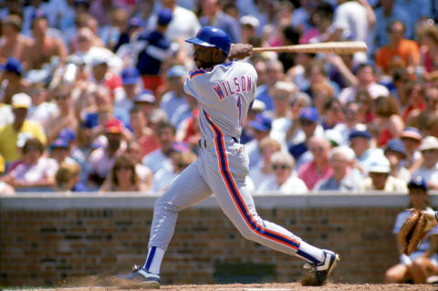 1989: Mookie Wilson of the New York Mets swings during a game in the 1989 season. (Photo by: Jonathan Daniel/Getty Images)