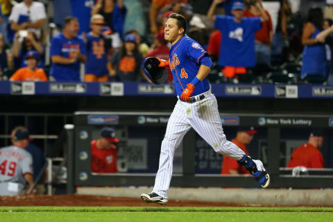 NEW YORK, NY – JULY 31: Wilmer Flores #4 of the New York Mets celebrates after hitting a twelfth inning walk-off home run against the Washington Nationals at Citi Field on July 31, 2015 in Flushing neighborhood of the Queens borough of New York City. Mets defeated the Nationals 2-1 in 12 innings. (Photo by Mike Stobe/Getty Images)