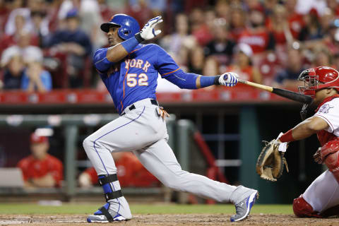 CINCINNATI, OH – SEPTEMBER 24: Yoenis Cespedes #52 of the New York Mets singles to drive in a run against the Cincinnati Reds in the seventh inning at Great American Ball Park on September 24, 2015 in Cincinnati, Ohio. (Photo by Joe Robbins/Getty Images)