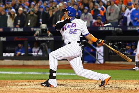 NEW YORK, NY – OCTOBER 30: Yoenis Cespedes #52 of the New York Mets hits an sacrifice fly RBI in the sixth inning against Kelvin Herrera #40 of the Kansas City Royals during Game Three of the 2015 World Series at Citi Field on October 30, 2015 in the Flushing neighborhood of the Queens borough of New York City. (Photo by Mike Stobe/Getty Images)