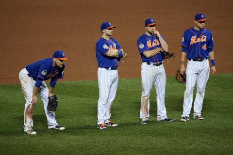 NEW YORK, NY – NOVEMBER 01: Lucas Duda #21, David Wright #5, Daniel Murphy #28 and Wilmer Flores #4 of the New York Mets look on as Matt Harvey #33 is relieved in the ninth inning against the Kansas City Royals during Game Five of the 2015 World Series at Citi Field on November 1, 2015 in the Flushing neighborhood of the Queens borough of New York City. (Photo by Doug Pensinger/Getty Images)