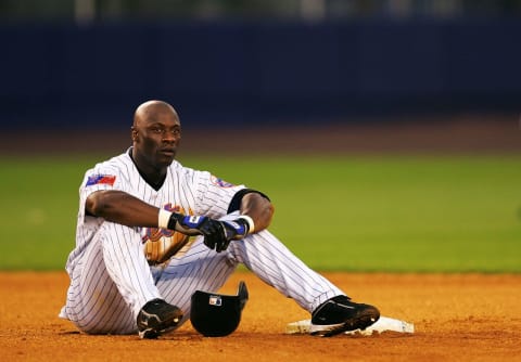 NEW YORK – JULY 19: Mike Cameron #44 of the New York Mets sits at second base after he was thrown out while trying to strech a single into a double against the Florida Marlins July 19, 2004, at Shea Stadium in Flushing, New York. (Photo by Ezra Shaw/Getty Images)