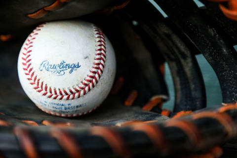 JUPITER, FL – MARCH 15: A detailed view of a Rawlings baseball sitting inside of a glove before the spring training game between the Miami Marlins and the New York Mets on March 15, 2016 in Jupiter, Florida. (Photo by Rob Foldy/Getty Images)