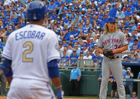 KANSAS CITY, MO – APRIL 05: Noah Syndergaard #34 of the New York Mets looks at Alcides Escobar #2 of the Kansas City Royals at third base during the first inning of a game at Kauffman Stadium on April 5, 2015 in Kansas City, Missouri. The Mets defeated the Royals 2-0. (Photo by Jay Biggerstaff/TUSP/Getty Images)