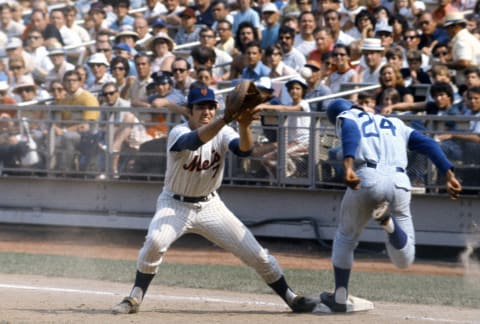 NEW YORK – CIRCA 1968: Jimmy McMath #24 of the Chicago Cubs is safe at first base beating the throw to Ed Kranepool #7 of the New York Mets during an Major League Baseball game circa 1968 at Shea Stadium in the Queens borough of New York City. Kranepool played for the Mets from 1962-79. (Photo by Focus on Sport/Getty Images)