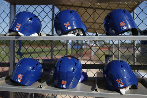 PORT SAINT LUCIE, FL – MARCH 9: Six New York Mets pitchers helmets sit in a rack next to the practice field as they run through drills prior to the spring training game against the Detroit Tigers at First Data Field on March 9, 2017 in Port Saint Lucie, Florida. The game ended in a 5-5 tie. (Photo by Joel Auerbach/Getty Images)