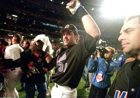 16 Oct 2000: Catcher Mike Piazza #31 of the New York Mets celebrate with win as he walks off the field after the National Leage Division Series Game Five against the St. Louis Cardinals at Shea Stadium in Flushing, New York. The Mets defeated the Cardinals 7-0.Mandatory Credit: Al Bello /Allsport