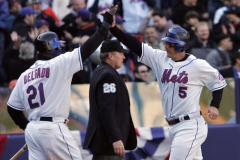 NEW YORK – APRIL 09: Carlos Delgado #21 and David Wright #5 of the New York Mets celebrate after scoring on a hit by Moises Alou #18 in the eighth inning against the Philadelphia Phillies during the home opener at Shea Stadium on April 9, 2007 in the Flushing neighborhood of the Queens borough of New York City. (Photo by Jim McIsaac/Getty Images)