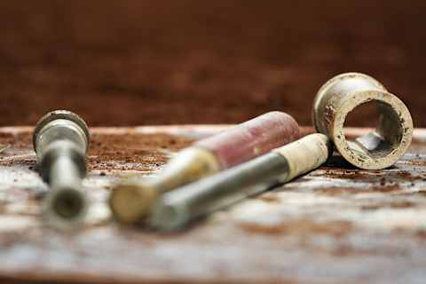 NEW YORK – JUNE 10: Bats and batting weights lay in the on deck circle during the game between the New York Mets against the Philadelphia Phillies during their game on June 10, 2009 at Citi Field in the Flushing neighborhood of the Queens borough of New York City. (Photo by Al Bello/Getty Images)