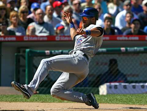 CHICAGO – AUGUST 30: Angel Pagan #16 of the New York Mets slides into home plate against the Chicago Cubs on August 30, 2009 at Wrigley Field in Chicago, Illinois. The Mets defeated the Cubs 4-1. (Photo by Jonathan Daniel/Getty Images)