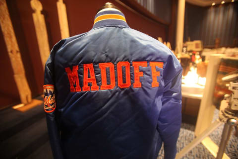 NEW YORK – NOVEMBER 13: A Bernard Madoff New York Mets baseball jacket is displayed during a press preview of a U.S. Marhals Service auction of personal property seized from Bernard and Ruth Madoff November 13, 2009 in New York City. The property includes jewelry, furs, artwork and other items forfeited in connection with the criminal prosecution of Bernard Madoff’s Ponzi scheme. (Photo by Mario Tama/Getty Images)