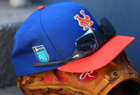 WEST PALM BEACH, FL – MARCH 08: The The New Era cap, Rawlings glove and Nike sunglasses of Jay Bruce #19 of the New York Mets in the dugout during a spring training game against the Washington Nationals at FITTEAM Ball Park of the Palm Beaches on March 8, 2018 in West Palm Beach, Florida. (Photo by Rich Schultz/Getty Images)